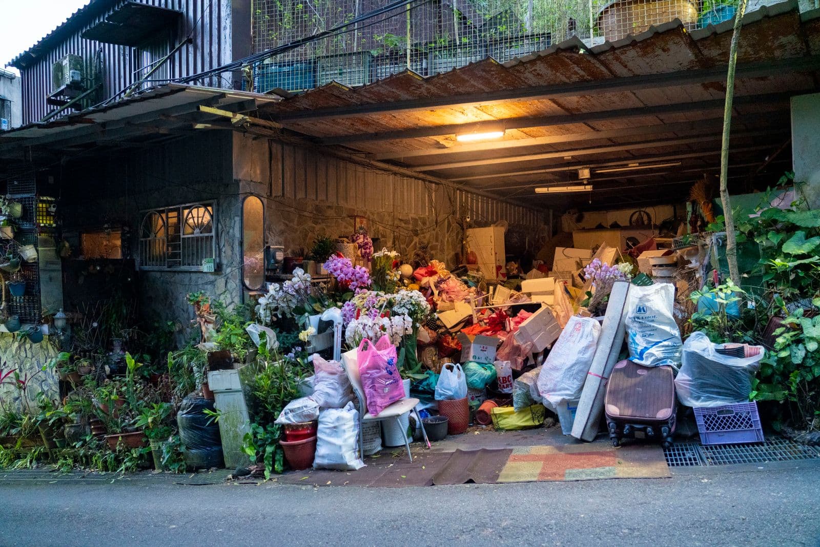Cluttered garage in an Orange County home ready for cleanout